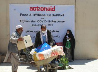 A Woman Participant waits for her turn to receive her Kit 